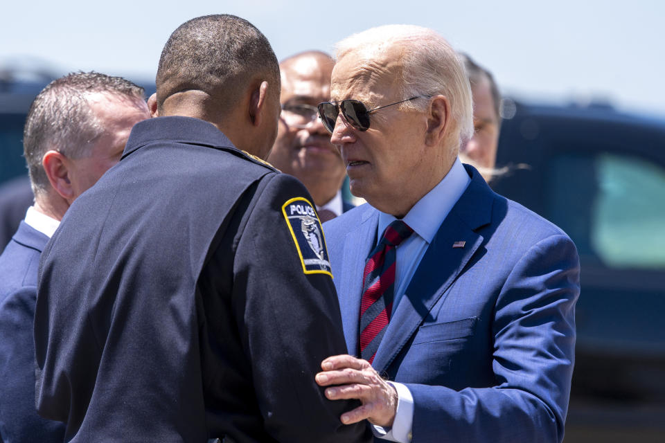 President Joe Biden greets Charlotte-Mecklenburg Police Department Chief Johnny Jennings, as he arrives on Air Force One at Charlotte Douglas International Airport, Thursday, May 2, 2024, in Charlotte, N.C. Biden is meeting with the families of law enforcement officers shot to death on the job. (AP Photo/Alex Brandon)