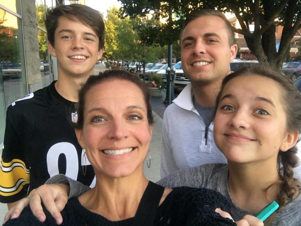 Calvin, left, with mom Carolyn Cort and his siblings.