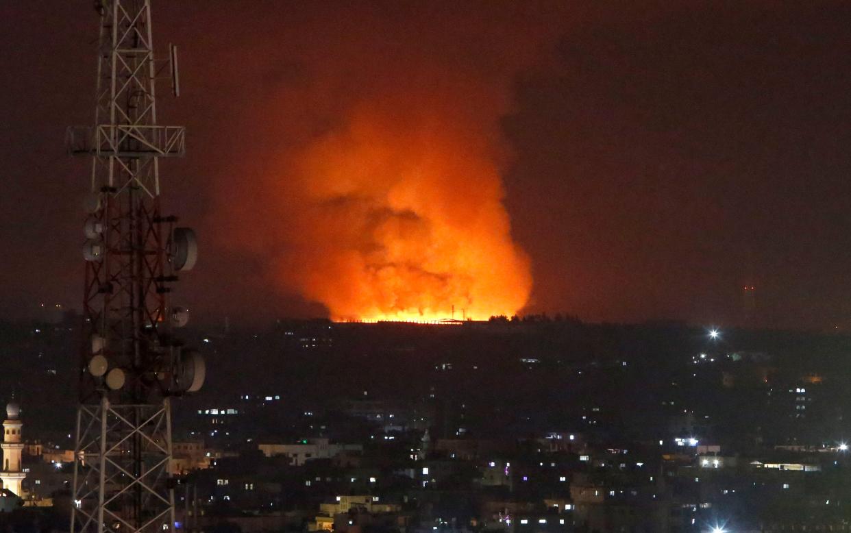 Fire burns and smoke rises after an Israeli Forces strike in the Gaza Strip, Monday, May 10, 2021.