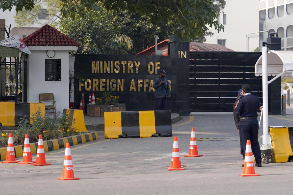 Police officers stand guard at the main entry gate of Pakistan's Ministry of Foreign Affairs, in Islamabad, Pakistan, Thursday, Jan. 18, 2024. Pakistan's air force launched retaliatory airstrikes early Thursday on Iran allegedly targeting militant positions, an attack that killed at least seven people and further raised tensions between the neighboring nations. (AP Photo/Anjum Naveed)