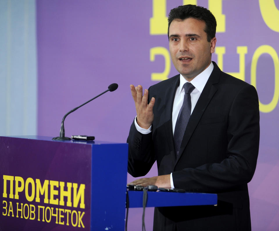 Leader of the oppositional social-democrats Zoran Zaev speaks at a news conference shortly after polls closed, in Skopje, Macedonia, on Sunday 27, 2014. Macedonia's center-left opposition won't recognize the results of twin parliamentary and presidential elections held in the country, said Zaev to the reporters on Sunday. The banner under reads “Changes for a new beginning”.(AP Photo/Boris Grdanoski)