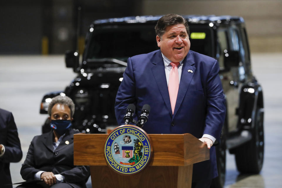 Governor J.B. Pritzker and Mayor Lori Lightfoot give an update on Chicago's reopening efforts at McCormick Place in Chicago on Tuesday, May 4, 2021. An announcement of auto show's return to McCormick Place was also made. (Jose M. Osorio /Chicago Tribune via AP)