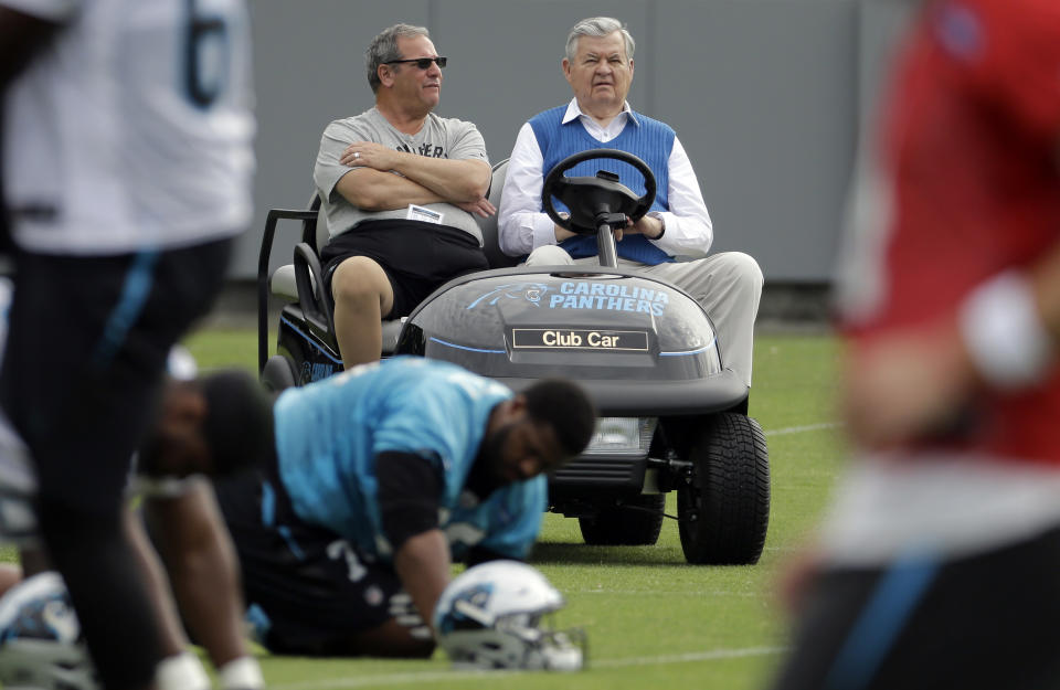 Carolina Panthers owner Jerry Richardson, right, is accused of numerous instances of sexual harassment as well as using a racial slur against one former employee. (AP)