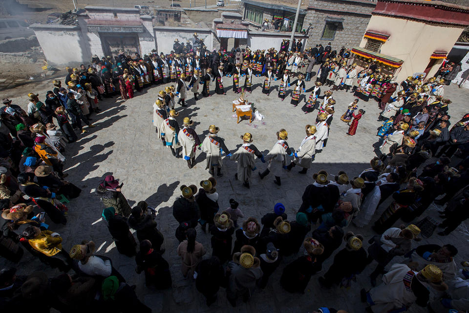 In this Feb. 17, 2019, photo released by Xinhua News Agency, people perform dance to celebrate the Tibetan New Year in Doilungdeqen of Lhasa, southwest China's Tibet Autonomous Region. China is barring foreign travelers from Tibet over a period of several weeks that includes a pair of sensitive political anniversaries. Travel agencies contacted Wednesday, Feb. 20 said foreign tourists would not be allowed into the Himalayan region until April 1. (Nam Jer/Xinhua via AP)