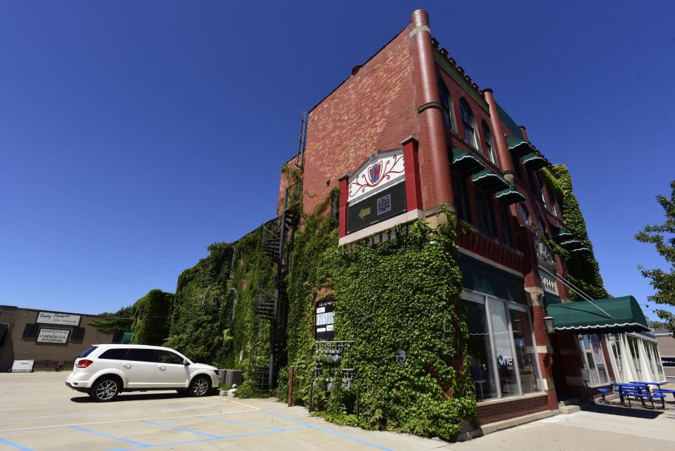 The Citadel building on Huron Ave., in downtown Port Huron on Friday, August 12, 2022. The building which includes the theatre space occupied by Enter Stage Right, a Primerica office space, Red Kettle Coffee Roasters, and upstairs lofts, is up for sale by the owners.