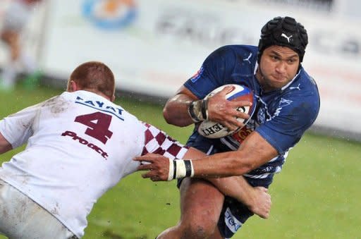 Bordeaux-BÃ¨gles' Cameron TrÃ©olard (L) tackles Agen's centre Manu Ahotaeiloa (R) during their French Top 14 rugby union match. Bordeaux defeated Agen 29-15