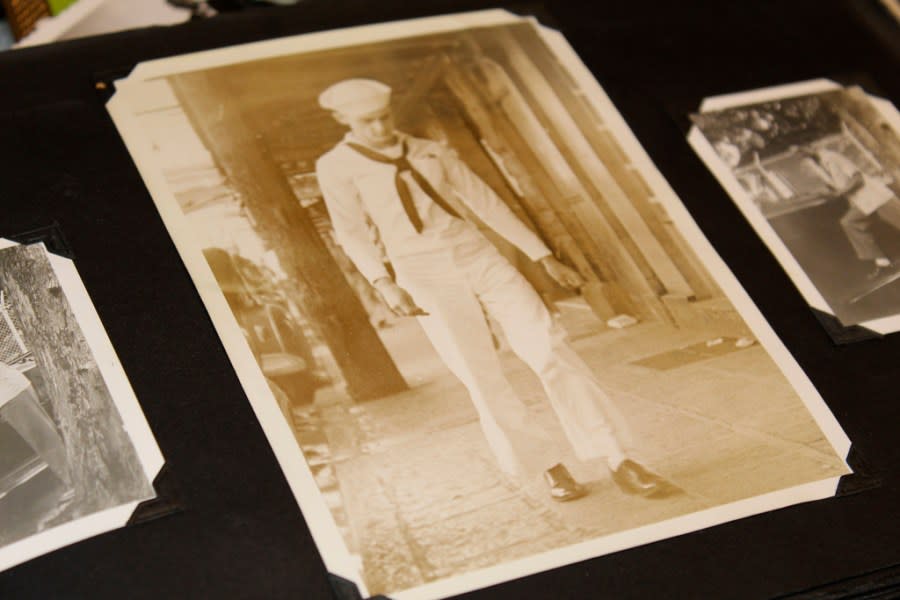 A photo album in the home of Ira “Ike” Schab in Beaverton, Ore. on Monday, Nov. 20, 2023, shows an old photo of him in his U.S. Navy uniform during his first shore leave on Oahu, Hawaii, in December 1941 after the Pearl Harbor attacks. Schab is now 103 years old and plans to return to Pearl Harbor for the 82nd anniversary of the attack to remember the more than 2,300 servicemen killed. (AP Photo/Claire Rush)