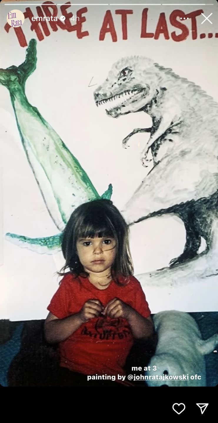 a girl sitting on a blanket