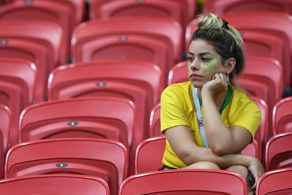 <p>A Brazil fan reacts to their loss during the Russia 2018 World Cup quarter-final football match between Brazil and Belgium at the Kazan Arena in Kazan on July 6, 2018. – Belgium beat World Cup favourites Brazil 2-1 on Friday to set up a semi-final against France in Saint Petersburg. (Photo by Manan VATSYAYANA / AFP) </p>