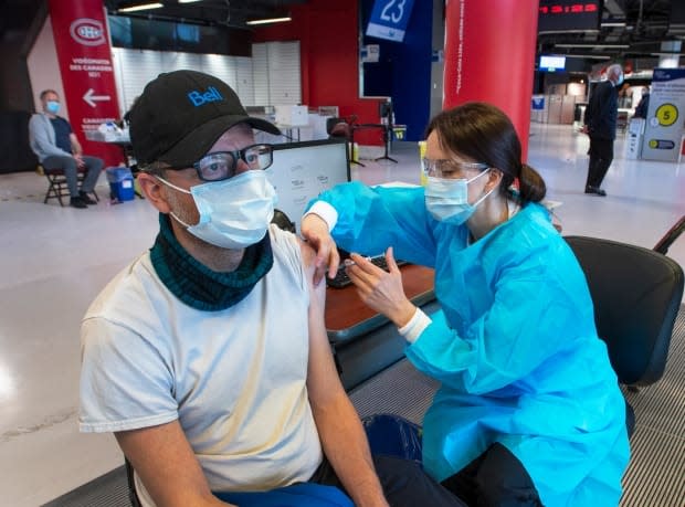 According to Premier Scott Moe, 13,651 people were vaccinated against COVID-19 on Sunday, setting a new provincial one-day record. (Ryan Remiorz/The Canadian Press - image credit)