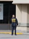 <p>Investigators looks over the scene where nine individuals were shot at a strip mall along Weslayan St. on September 26, 2016 in Houston, Texas. (Bob Levey/Getty Images) </p>