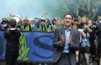 FILE - In this June 30, 2018, file photo, Seattle Sounders owner Adrian Hanauer, right, takes part in the traditional March to the Match before an MLS soccer match between the Sounders and the Portland Timbers in Seattle. The Sounders announced Tuesday, Aug. 13, 2019, that they are adding Seattle Seahawks quarterback Russell Wilson and several others to the club's ownership group, as Hollywood producer Joe Roth leaves the franchise. (AP Photo/Ted S. Warren, File)