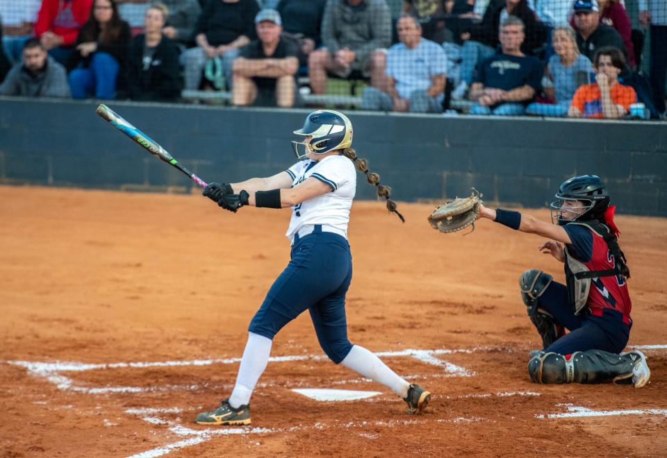 Jacey Reed (2) knocks a shot to left field for a single during the Fort Walton Beach vs Gulf Breeze 1-5A District championship softball game at Gulf Breeze High School on Thursday, May 4, 2023.