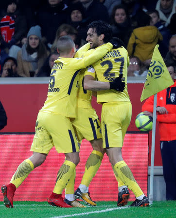 Soccer Football - Ligue 1 - LOSC Lille vs Paris St Germain - Stade Pierre-Mauroy, Lille, France - February 3, 2018 Paris Saint-Germain’s Yuri Berchiche celebrates scoring their first goal with Marco Verratti and Javier Pastore REUTERS/Charles Platiau