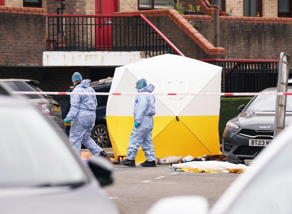 Police  forensic officers at the scene near Bywater Place in Surrey Quays (PA)