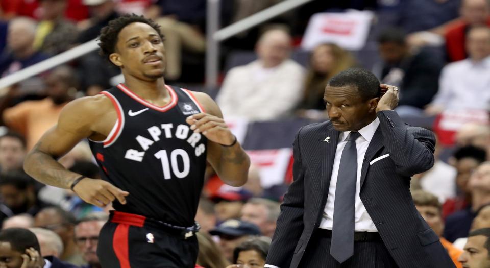 <span>Dwane Caset gives advice to DeMar DeRozan on returning to Toronto (Photo by Rob Carr/Getty Images)</span>