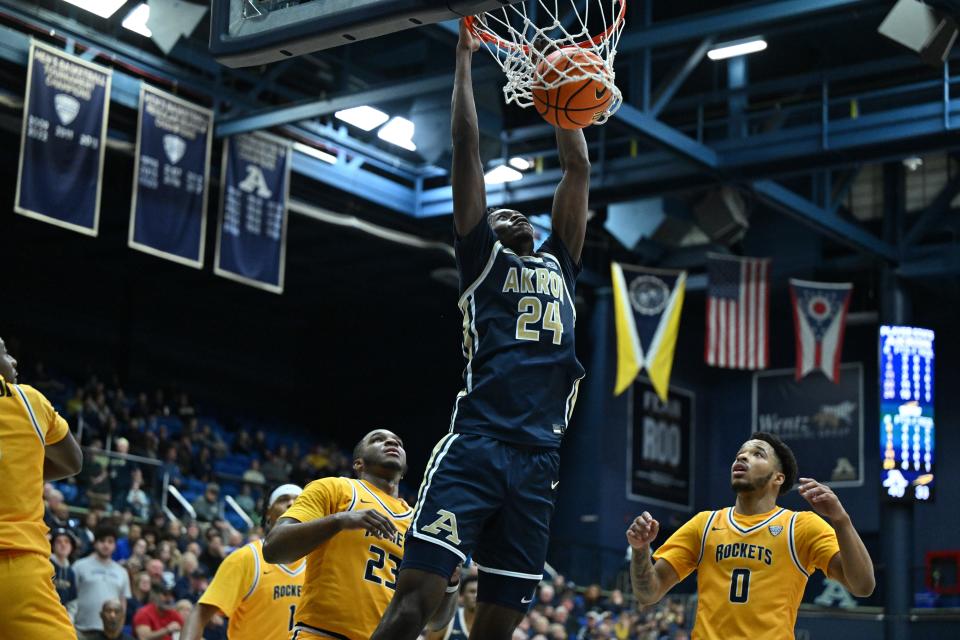 Akron forward Ali Ali dunks the ball Friday against Toledo in Akron.