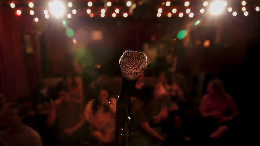 A mic looking out onto the stage of the crowd at East Austin Comedy Club. <span class="copyright">(James Gregg / For the Times)</span>