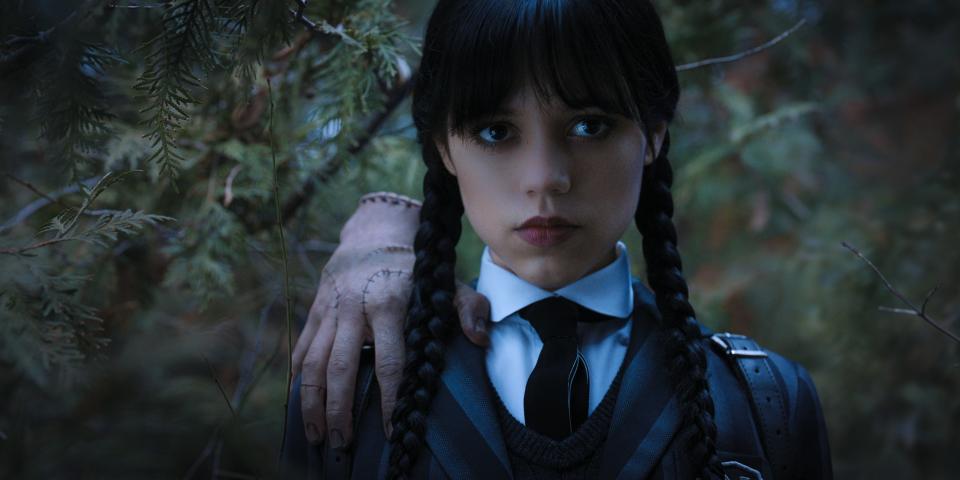 Thing and Jenna Ortega as Wednesday Addams