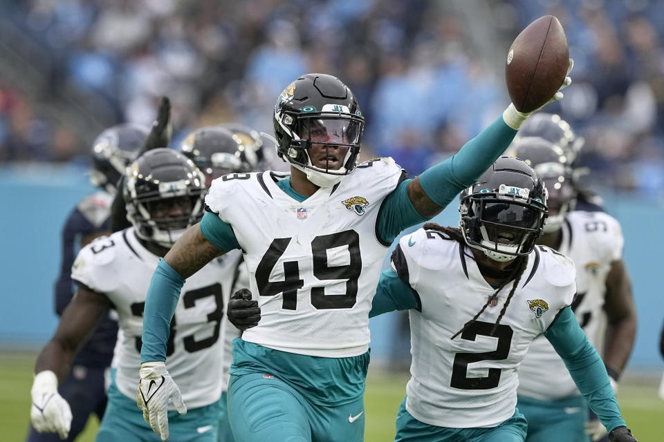 Jacksonville Jaguars defensive end Arden Key (49) celebrates after recovering a fumble during the second half of an NFL football game against the Tennessee Titans Sunday, Dec. 11, 2022, in Nashville, Tenn. (AP Photo/Chris Carlson)