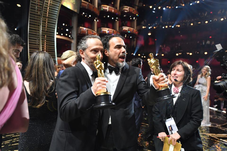 Cinematographer Emmanuel Lubezki and best director Alejandro G. Inarritu celebrate during the 88th annual Academy Awards, where they won for "The Revenant."