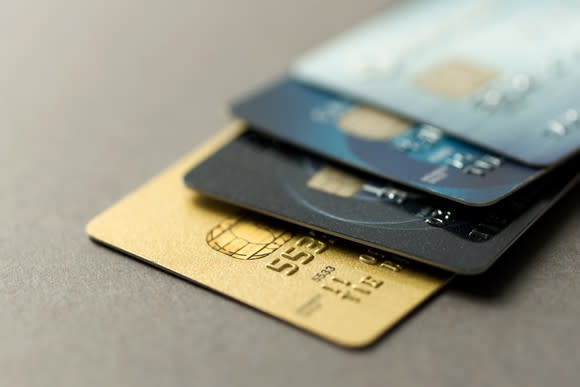 Four credit cards on a flat surface