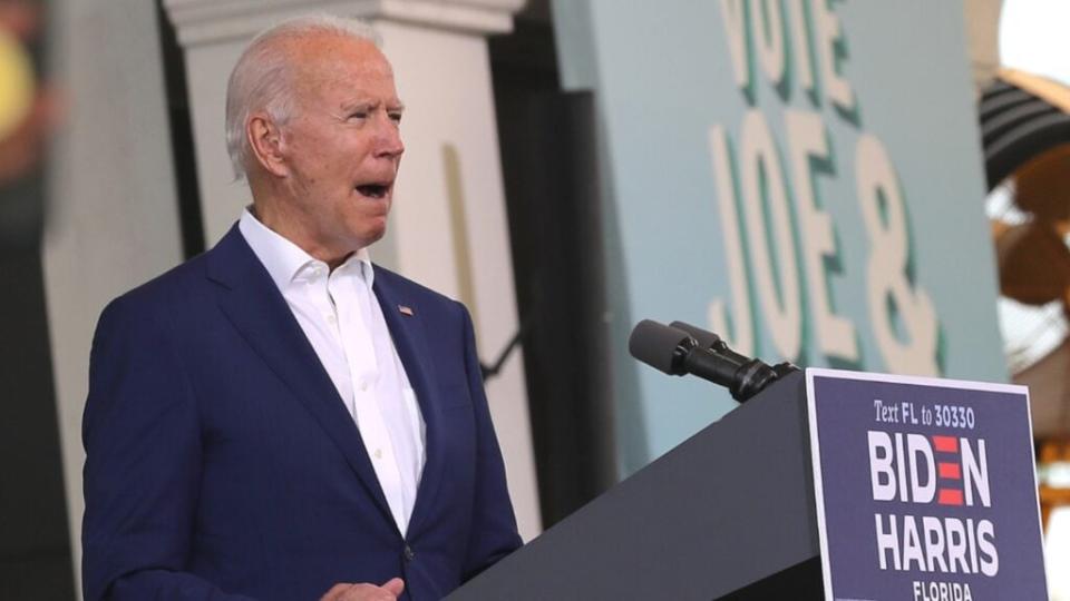 Democratic presidential nominee Joe Biden addresses supporters during a drive-in voter mobilization event Tuesday at Miramar Regional Park in Miramar, Florida. (Photo by Chip Somodevilla/Getty Images)