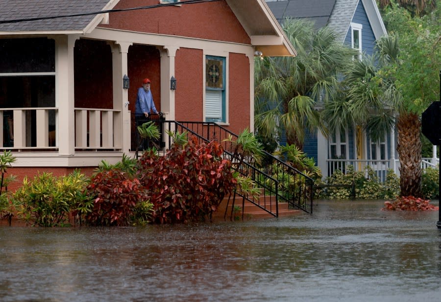 Steve Odom stands on the porch of his home that is surrounded by flood waters caused by Hurricane Idalia passing offshore on August 30, 2023 in Tarpon Springs, Florida. Hurricane Idalia is hitting the Big Bend area on the Gulf Coast of Florida. (Photo by Joe Raedle/Getty Images)