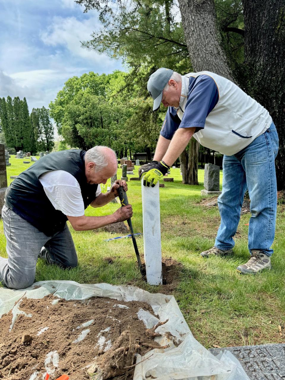 On Monday, May 21 members of the Sons of the American Revolution, Tony Townsend of Marion and Mike Rowley of Clive, installed a 240-pound marble stone to mark John Kapsa's grave in the Oakland Cemetery.