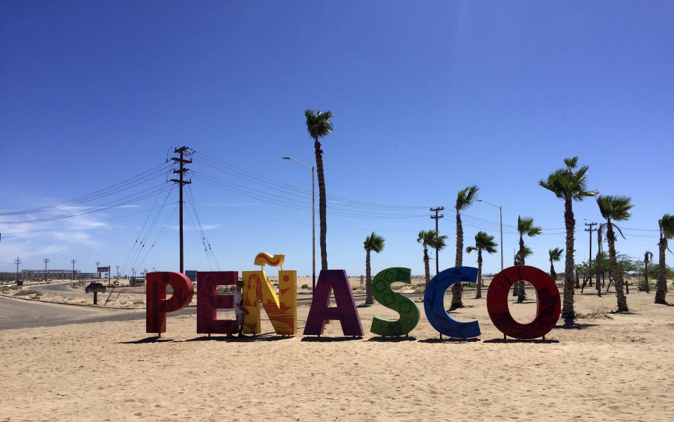 This September 2018 photo shows the beach at the popular tourist resort of Puerto Peñasco in the state of Sonora, Mexico. Fears about possible coronavirus infections from hard hit Arizona and regional politics south of the U.S.-Mexico border saw American vacationers turned back on the road to the popular tourist resort of Puerto Peñasco over the long July 4 weekend. The spat in the small community of Sonoyta erupted against a backdrop of local rivalries and resentments, international politics and growing fears about virus spread along the 2,000-mile border. (AP Photo/Annika Wolters)