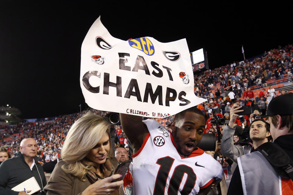 Georgia wide receiver Kearis Jackson (10) celebrates Georgia clinching the Southeastern Conference East after they defeated Auburn 21-14 in an NCAA college football game, Saturday, Nov. 16, 2019, in Auburn, Ala. (AP Photo/Butch Dill)