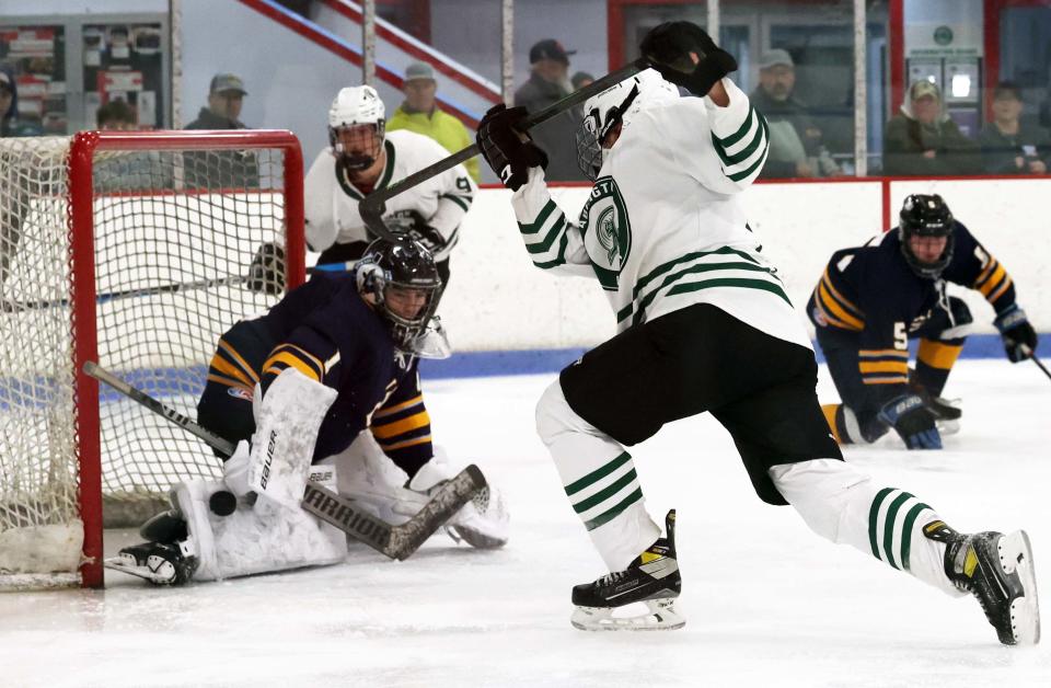 Cohasset/Hull goalie Luke Cosentino makes the third period save on Abington's Hunter Grafton during a game on Wednesday, Jan. 25, 2023.