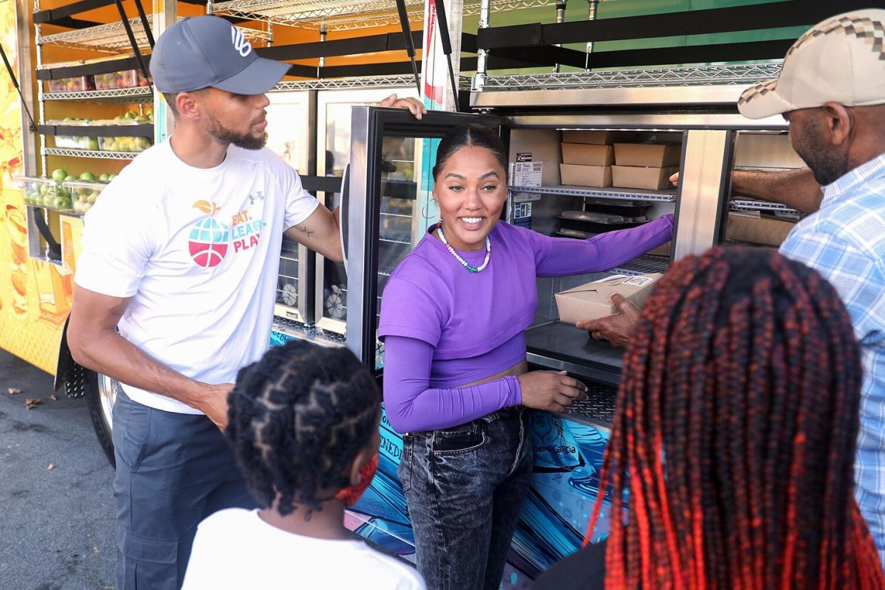 Stephen Curry and Ayesha Curry attend Stephen and Ayesha Curry's Eat. Learn. Play., unveiling a new mobile resource center at Franklin Elementary School on September 08, 2021 in Oakland, California