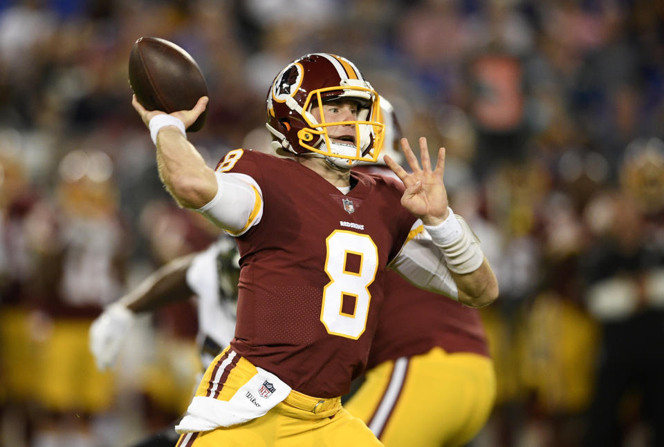 Washington Redskins quarterback Kevin Hogan throws to a receiver in the first half of a preseason NFL football game against the Baltimore Ravens, Thursday, Aug. 30, 2018, in Baltimore. (AP Photo/Nick Wass)