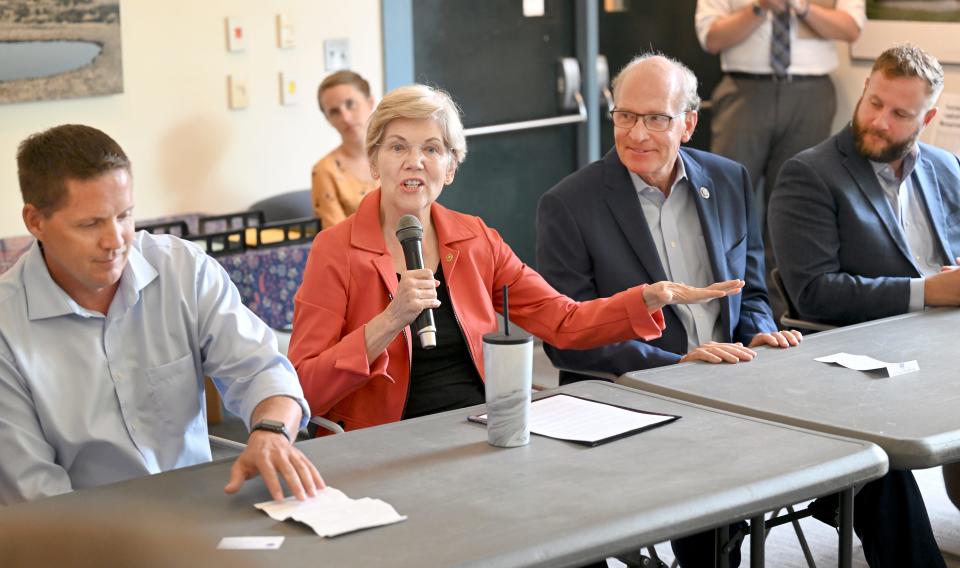 Sen. Elizabeth Warren talks about the federal support of the Herring River Restoration Project with Town Administrator Richard Waldo (left) and Congressman William R. "Bill" Keating, D-Mass., and state Sen. Julian Cyr, D-Truro, at the Wellfleet town library Tuesday afternoon.