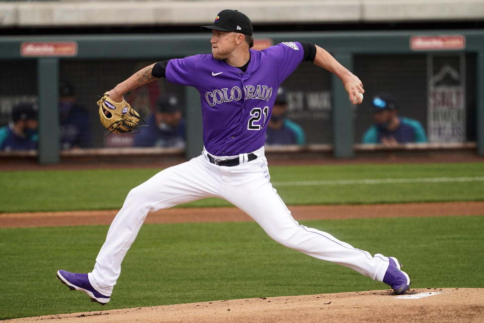 Colorado Rockies starting pitcher Kyle Freeland (21) throws against the Seattle Mariners during the first inning of a spring training baseball game, Saturday, March 13, 2021, in Scottsdale, Ariz. (AP Photo/Matt York)