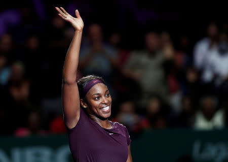 Tennis - WTA Tour Finals - Singapore Indoor Stadium, Kallang, Singapore - October 22, 2018 Sloane Stephens of the U.S. celebrates winning her group stage match against Japan's Naomi Osaka REUTERS/Edgar Su