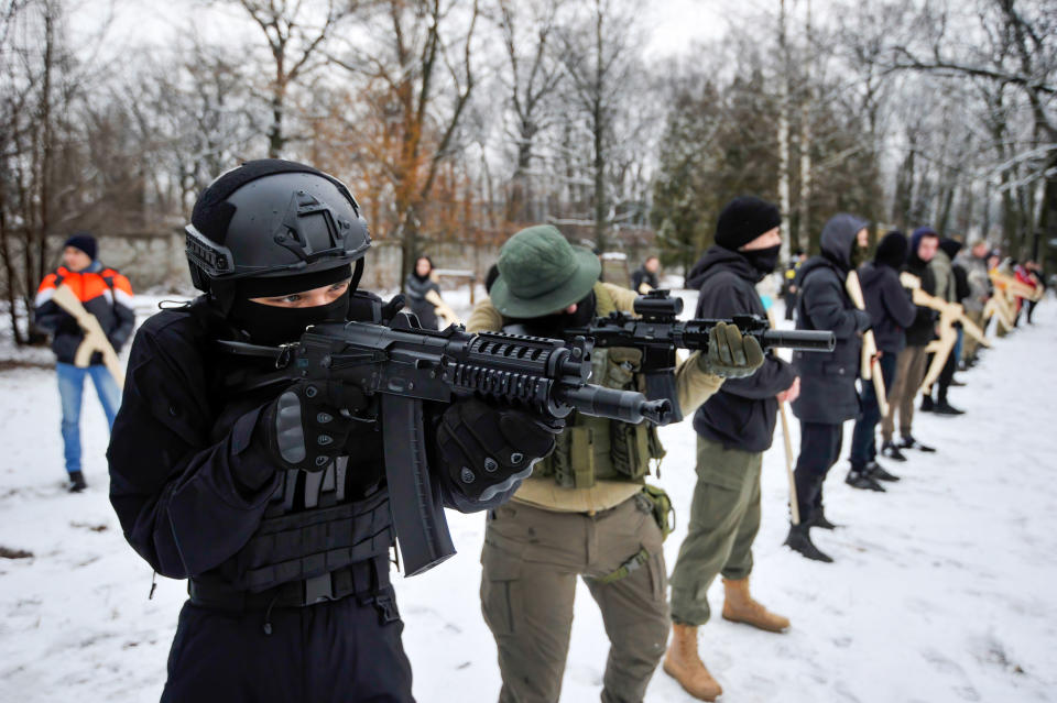 Ukrainian civilians attend a military training