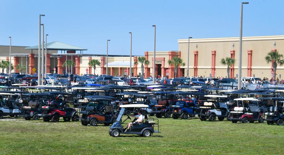 Golf carts are popular, and mainly used by students at Viera High School. Photo taken after the 3:30 p.m. end of the school day.