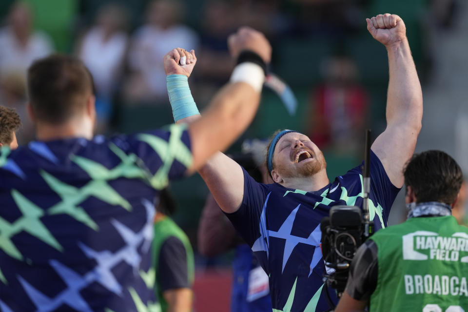 Ryan Crouser celebrates after setting a world record during the finals of men's shot put at the U.S. Olympic Track and Field Trials Friday, June 18, 2021, in Eugene, Ore. (AP Photo/Charlie Riedel)