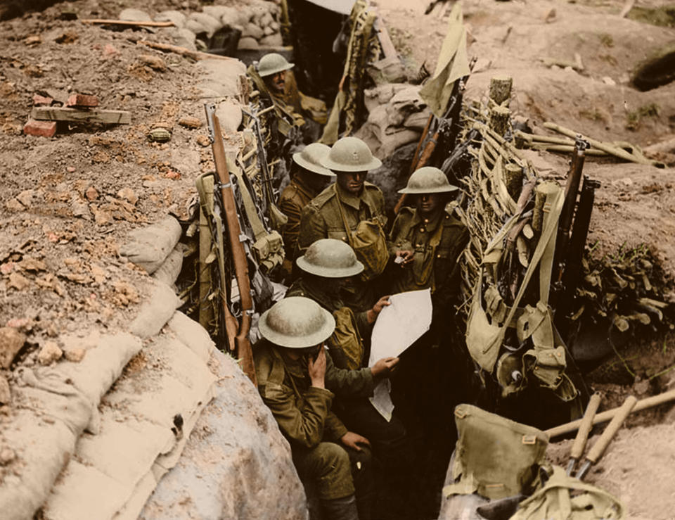 <p>Soldiers, probably from the 12th Battalion, the East Surrey Regiment, in a British communication trench in Ploegsteert Wood, during the Battle of Messines, 11th June 1917. (Tom Marshall/mediadrumworld.com) </p>