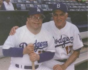 Jimmy Erskine (left) with his dad, Dodgers great Carl Erskine.