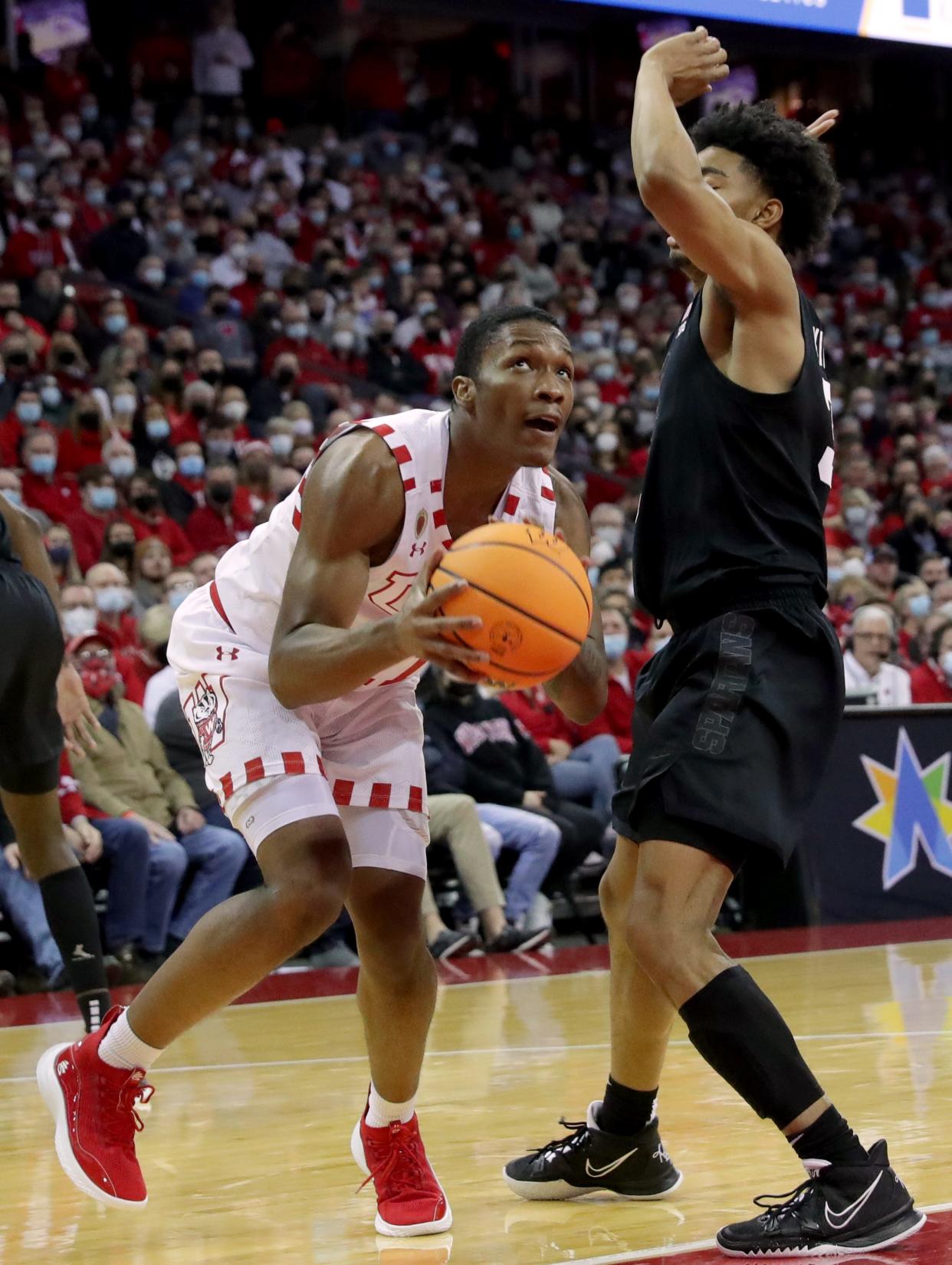 Wisconsin guard Lorne Bowman II (11) shoots on Michigan State guard Jaden Akins (3) during the second half of their game at the Kohl Center Friday, January 21, 2022 in Madison, Wis. Michigan State beat Wisconsin 86-74.