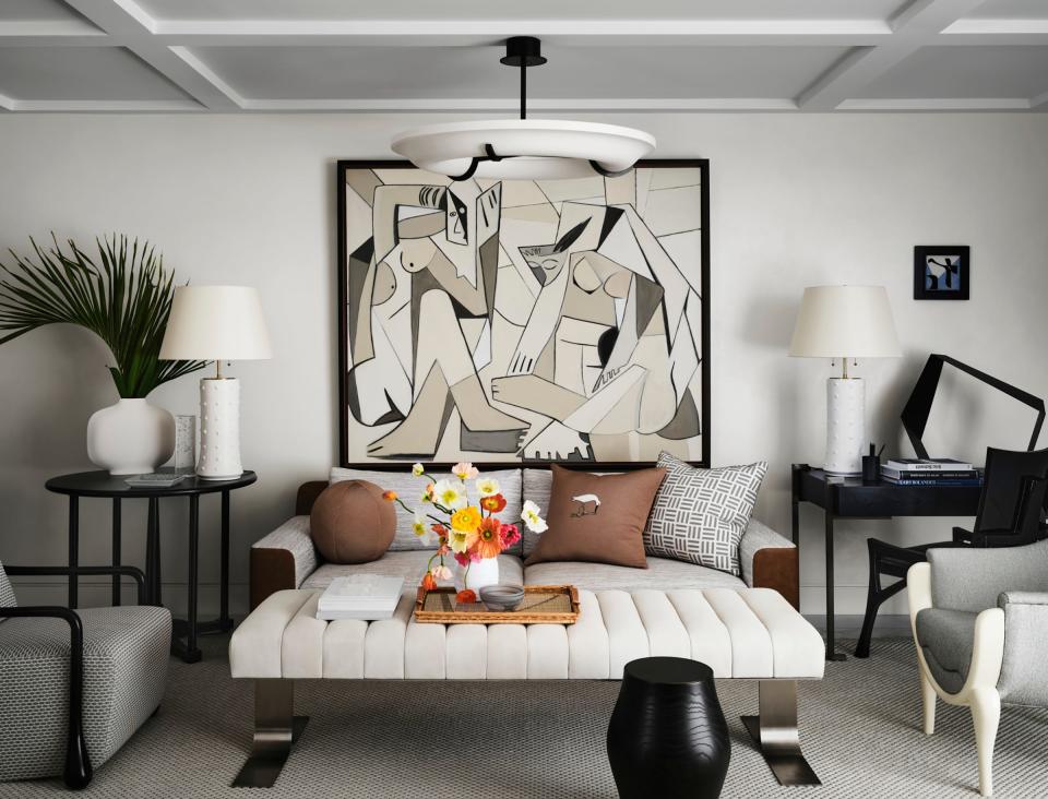 An untitled painting by artist George Williamson hangs above the sofa at one end of the living room.