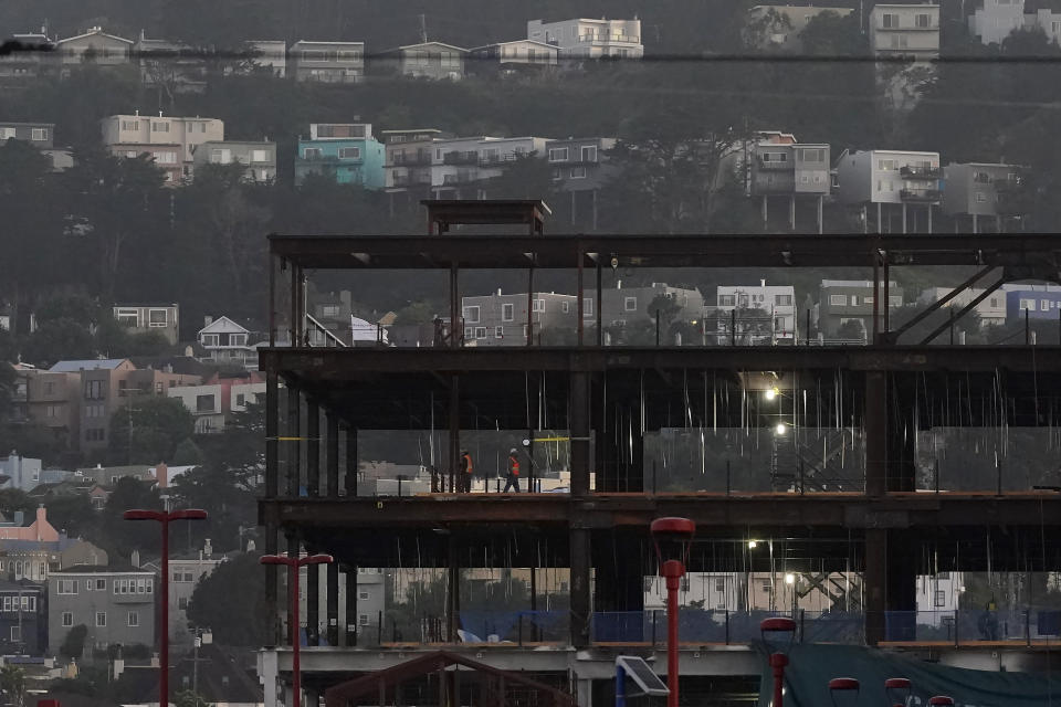 FILE - A construction crew works on a structure next to the City College of San Francisco campus on Sept. 11, 2023 in San Francisco. New numbers released Friday, March 22, 2024, show California has the highest unemployment rate in the country. Job losses in February were led by a drop in the construction industry. (AP Photo/Jeff Chiu, File)