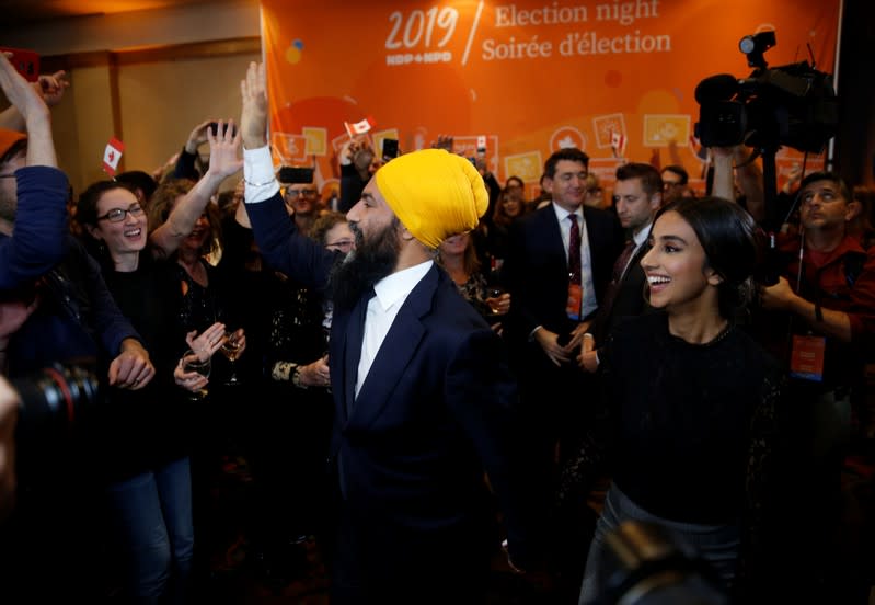 NDP leader Jagmeet Singh and wife Sidhu greet supporters after Singh was re-elected in Burnaby South at an NDP election night party in Burnaby