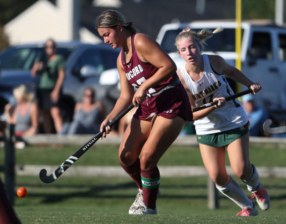 Concord's Rachel Waslyn (left) tries to clear the ball way from St. Mark's Lauren Daly in the second half of the Spartans' 6-0 win at St. Mark's High School, Wednesday, Oct. 4, 2023.