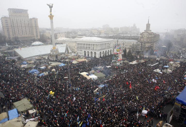 People gather for a mass rally of the opposition on Independence Square in Kiev on February 9, 2014