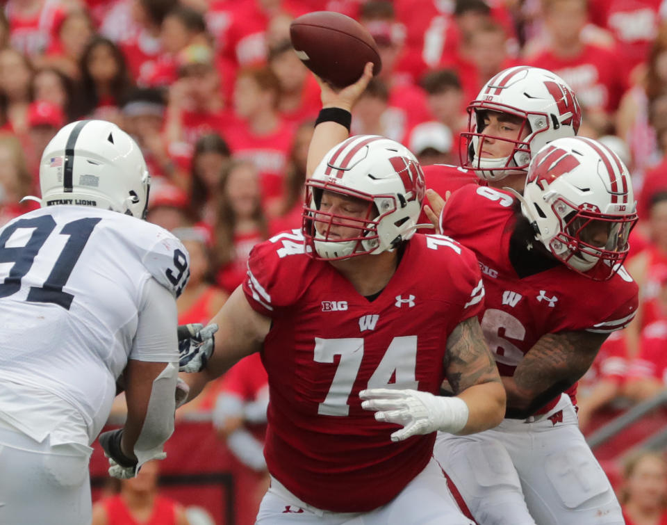 Sep 4, 2021; Madison, WI, USA; Wisconsin quarterback Graham Mertz benefits from protection by offensive lineman Michael Furtney (74) while making a throw during the fourth quarter of their game Saturday, September 4, 2021 at Camp Randall Stadium in Madison, Wis. Penn State beat Wisconsin 16-10. Mandatory Credit: Mark Hoffman-USA TODAY Sports