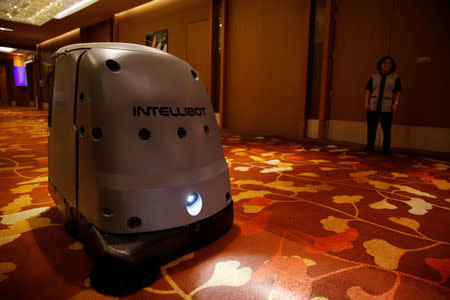 A robot cleans the hallway of the Marina Bay Sands convention centre in Singapore June 30, 2016. Picture taken June 30, 2016. REUTERS/Edgar Su